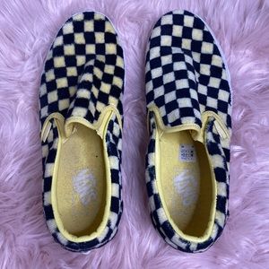 Black and yellow fluffy checkerboard slip on vans